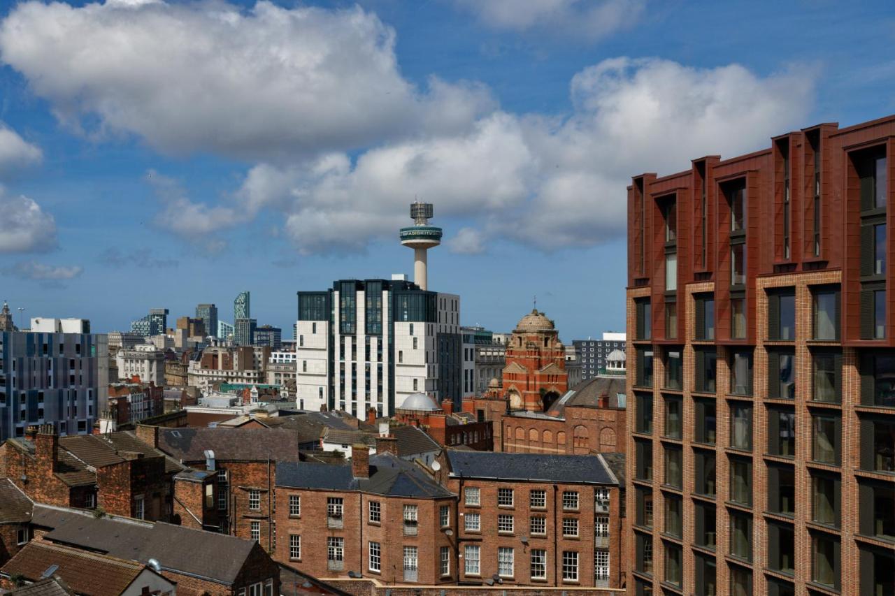 A view of Liverpool city centre buildings and a tower from the apartment balcony