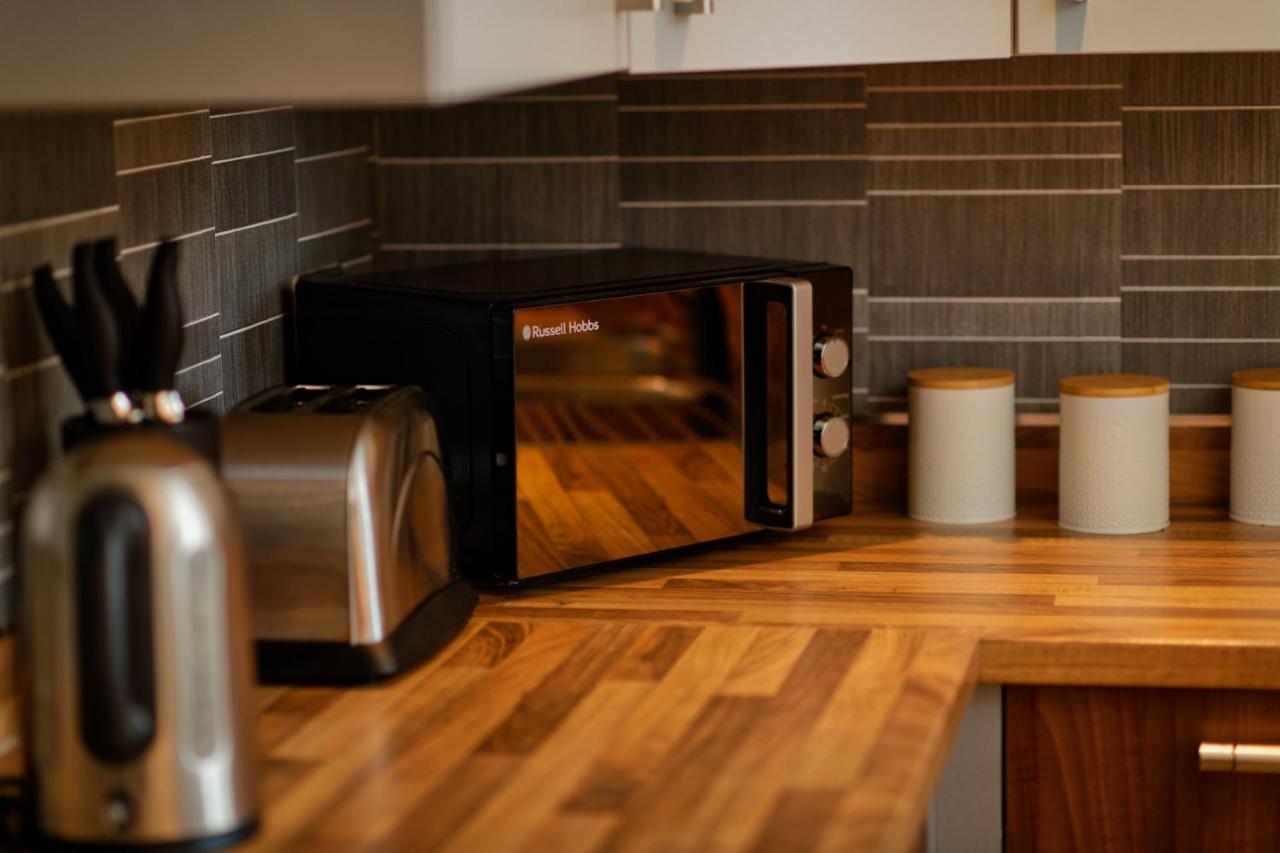 A microwave on the kitchen counter in the Liverpool city centre apartment
